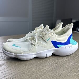 Nike Women's Free RN 5.0 running shoes in the "Sail/Aurora Green-Racer Blue"